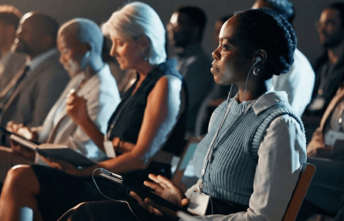 Live event attendees experiencing audio and caption output in dozens of languages