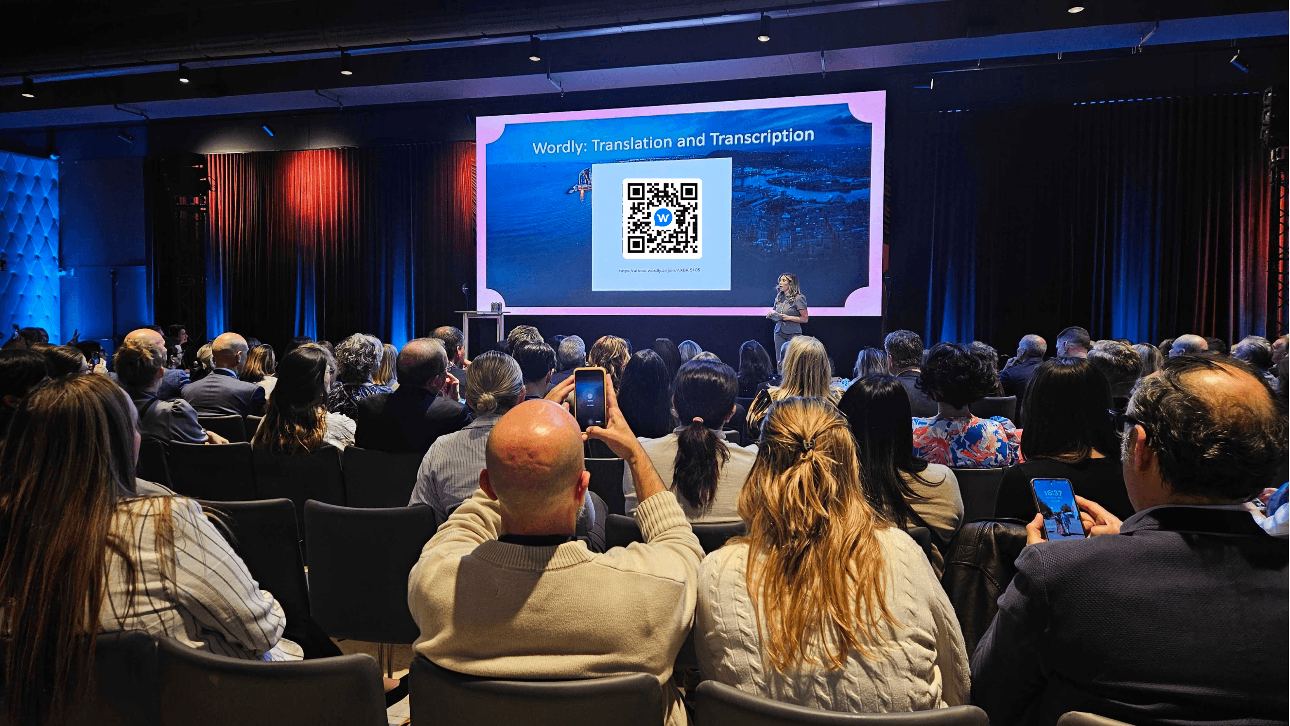 Event attendee scanning a Wordly QR code to access live AI translation